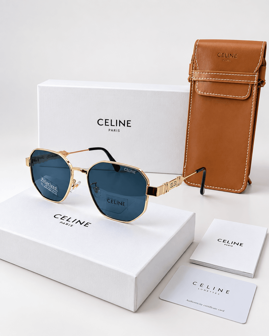 Lentes Celine en color dorado / cristales oscuros, con estuche
