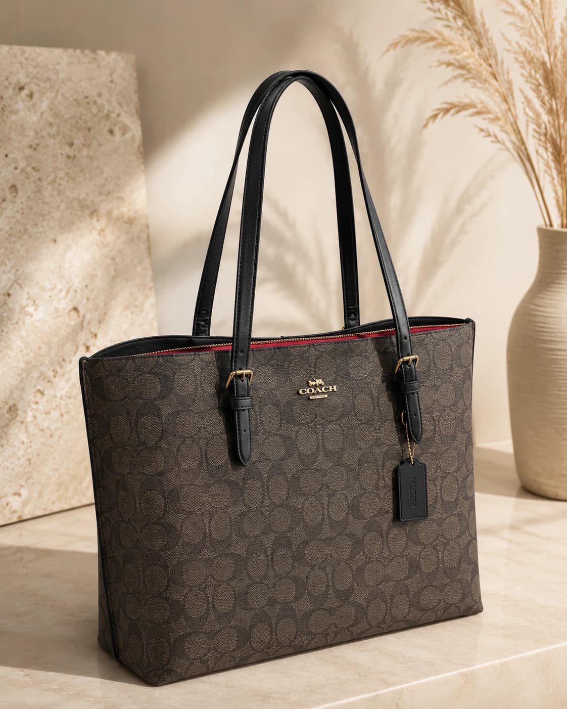 Tote Coach marrón con asas negras